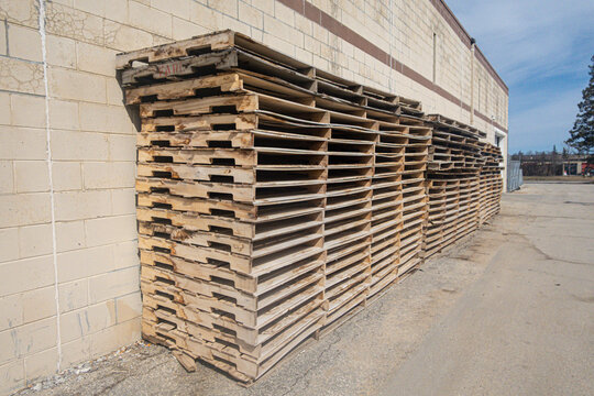 Pile of used wooden pallets to recycle