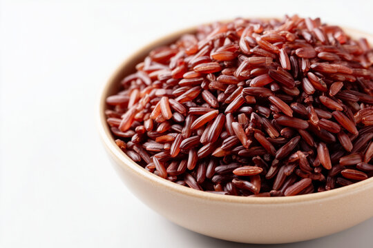 Bowl of purple rice grains healthy organic food ingredient isolated on white background
