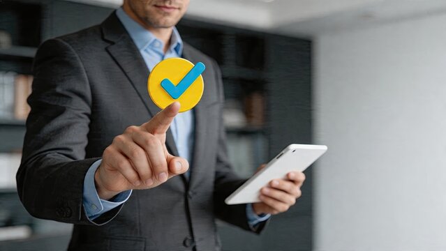 Businessman tapping a tablet screen to select or approve a virtual checkmark symbol interaction with technology user interface for success verification