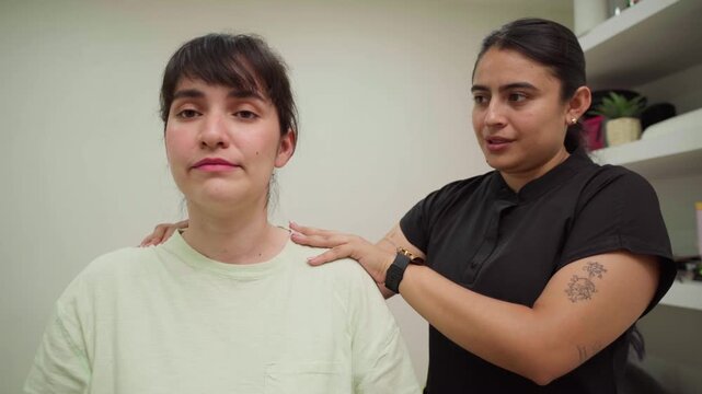 Female physical therapist helping a patient with neck stretching exercises to relieve pain and improve mobility, showcasing chiropractic care and muscle rehabilitation techniques