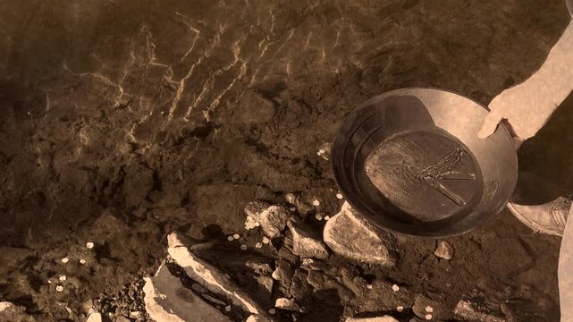 Panning for gold in the style of an old west photograph.