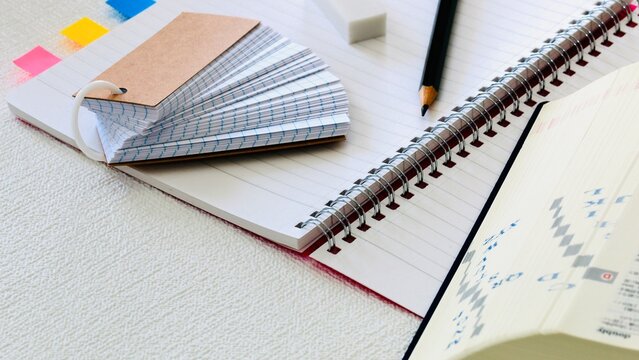 Learning Setup with Flashcards and Notebook on Desk