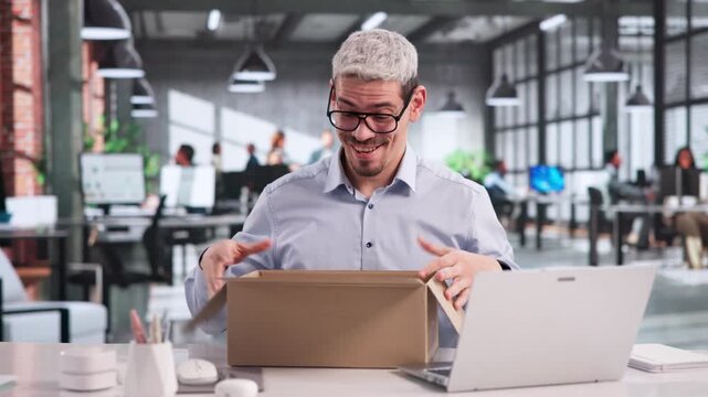Manager Happily Opening A Gift Package Received