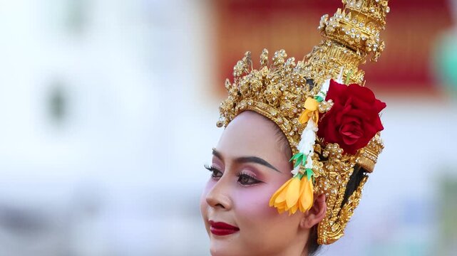 Close Up of Thai Khon Dancer in Traditional Golden Headdress