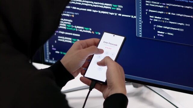 Hacker Carefully Types On Computer Trying