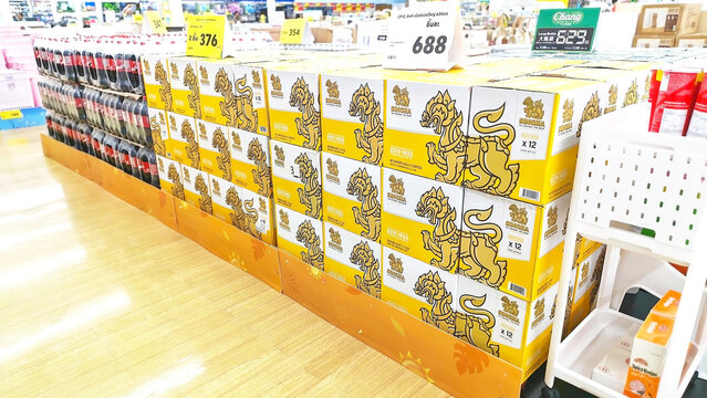 A vibrant assortment of Singha beer packs neatly arranged on supermarket shelves. Thailand, April 17, 2026