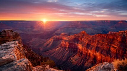 Naklejka premium Grand canyon landscape with sun rising over rock formations