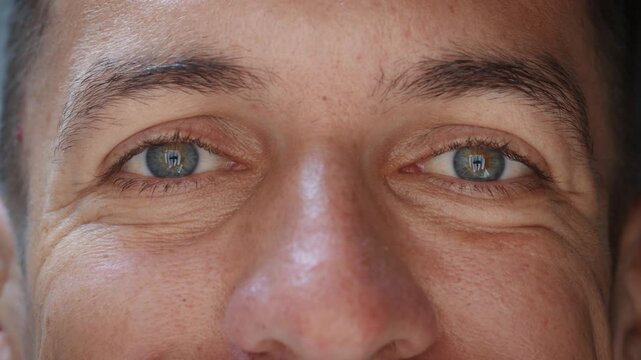 Friendly male eyes with slight smile create feeling of trust and openness. Direct gaze and relaxed expression communicate approachability honesty and positive communication for social and business use