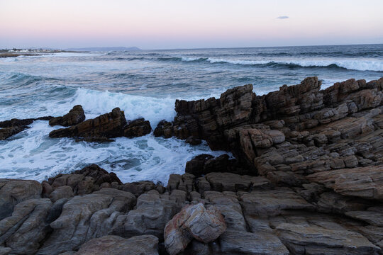 rocky coastline of Onrus, South Africa at dusk