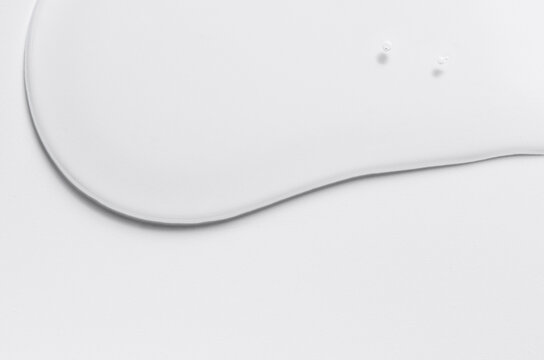 Cosmetic product in the form of a transparent drop. A moisturizing gel or serum for the face. Copy space