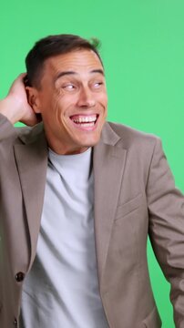 Shy man feeling embarrassed on green screen
