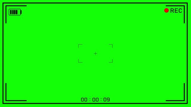 digital camera recording viewfinder interface featuring a green screen background, battery indicator, record light, focus reticle & timecode for professional video editing & post-production projects