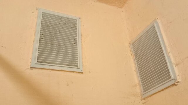 Ventilation grille on the wall with cobwebs in the bathroom. Hood, ventilation system in the house, bathroom