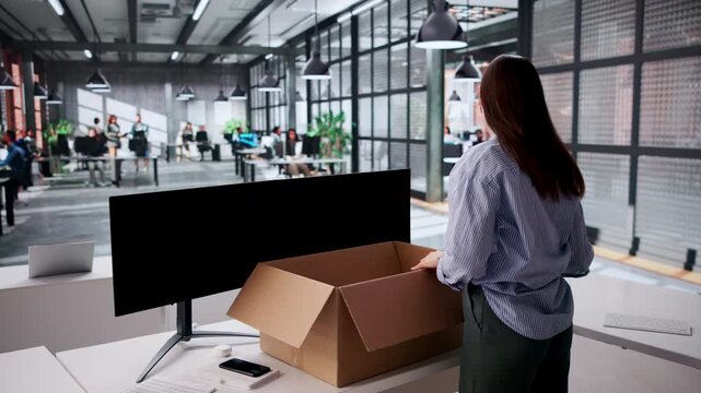 Saleswoman Packing Her Desk Box While Resigning