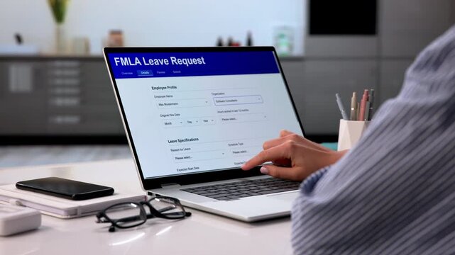 Woman Filling Out FMPLA Leave Request Form Online At Home