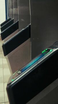 Close Up of Hand Tapping Contactless Card on NYC Subway OMNY Reader
Vertical 4K close-up of a person using a contactless phone NFC to pay for a fare at a New York City MTA subway turnstile.
