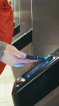 Close Up of Hand Tapping Contactless Card on NYC Subway OMNY Reader
Vertical 4K close-up of a person using a contactless phone NFC to pay for a fare at a New York City MTA subway turnstile.