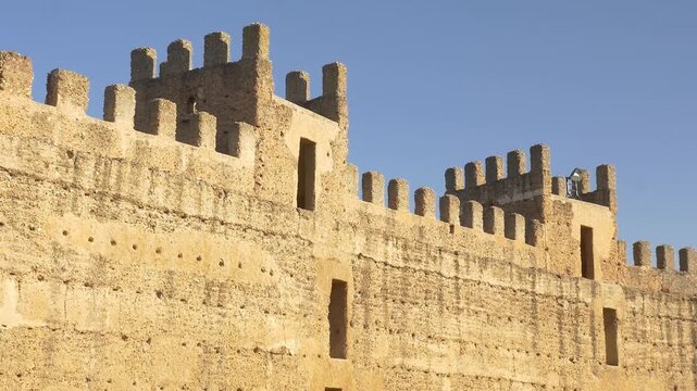 Static plan of the historic walls and defensive towers of Burgalimar Castle in Ba&ntilde;os de la Encina, Spain, showing the old rammed earth masonry and battlements.