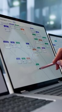Young Female Business Analyst Reviews Workflow Automation Tasks