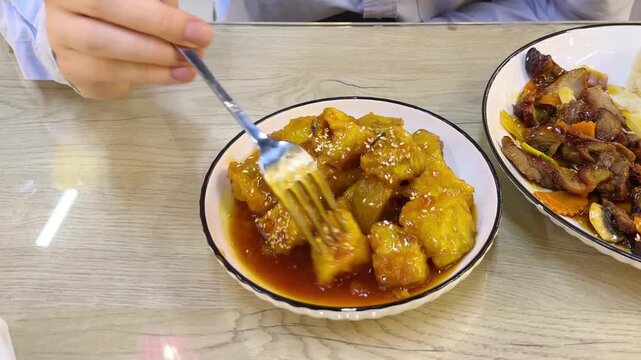 Trying local Asian street food.Tourist man eating asian food street local cafe