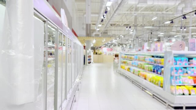 Choosing food from shelf at the supermarket,vegetables in the grocery section, Grocery stores 