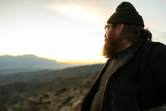 ginger man in beanie at keys view at sunset