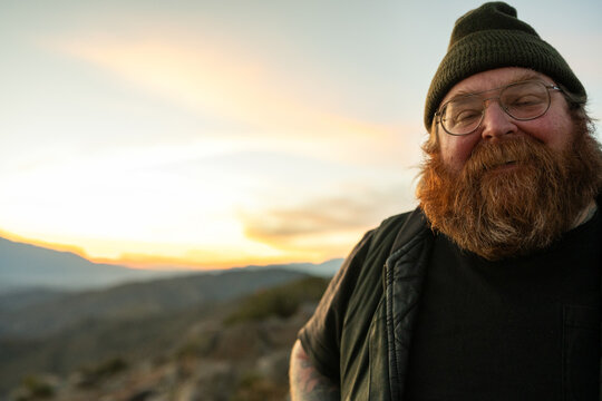 ginger man in beanie at keys view at sunset