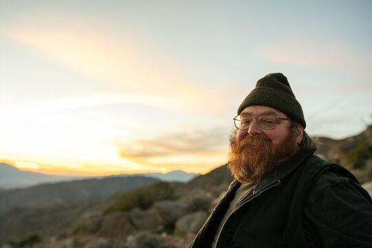 ginger man in beanie at keys view at sunset