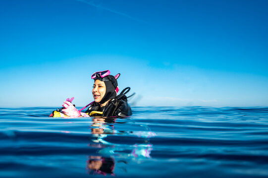 Diver surfacing after a dive in the southern Maldives