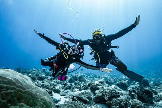 Diver playing in the current in the southern Maldives