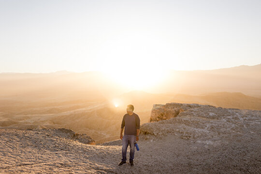 Wide View of Middle Aged Man Standing at Font's Point at Sunset in CA