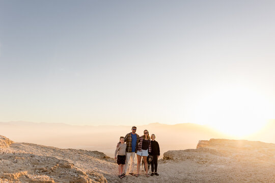 Family of Four Posing at Font's Point at Sunset in Borrego Springs, CA