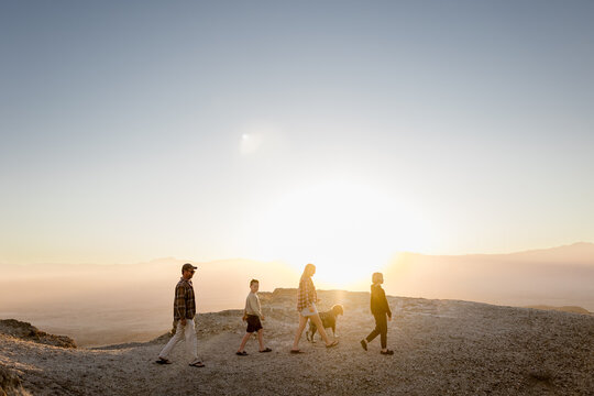 Family of Four Walking with Dog at Font's Point at Sunset in CA