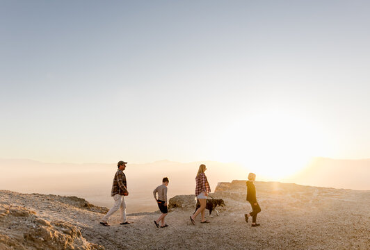 Family of Four Walking with Dog at Font's Point at Sunset in CA