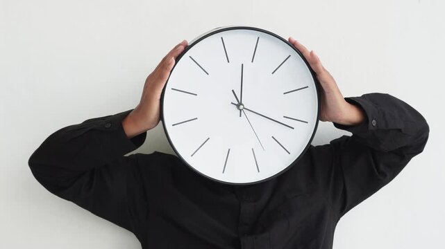 A person holding a wall clock. Illustration of time.