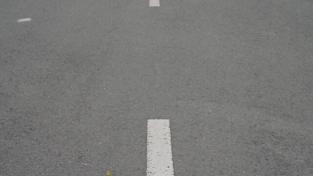 Asphalt road texture with moving lane line perspective dynamic driving background