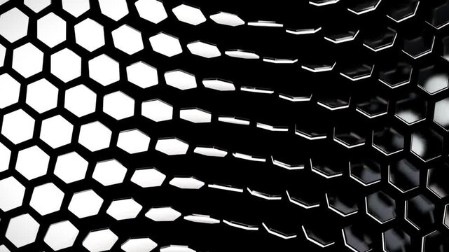 Monochrome hexagonal grid shifting in a fluid wave motion with high contrast lighting.