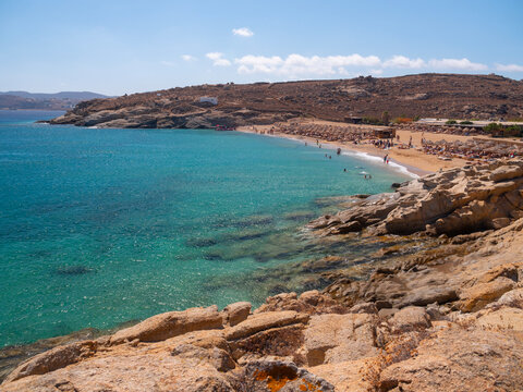 Panoramic view of Lia beach with tourists on the island of Mykonos in Greece.