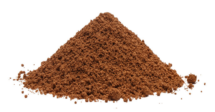 Ground cinnamon pile with fine powder texture and rich brown color, isolated on cutout transparent background