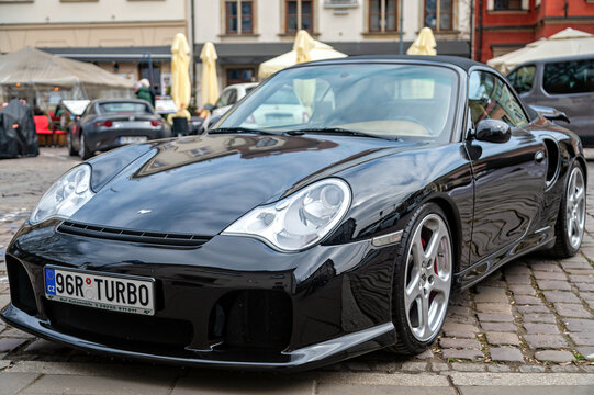 RUF 996 RTurbo cabriolet parked in Krakow town square during a sunny day