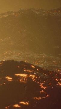 Hot lava flows across the ground, creating bright orange and red patches. The scene shows an active volcanic landscape with smoke and heat waves. The time is near sunset.