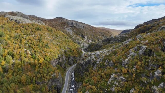 Aerial drone establishing shot E45 road and river valley Finnmark