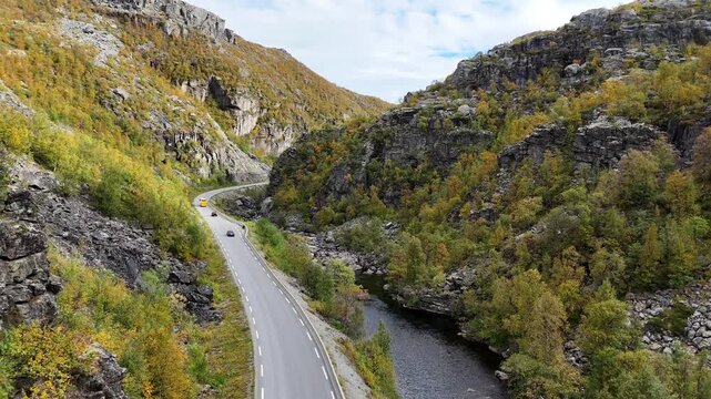 Aerial drone high wide shot of E45 road valley and winding river