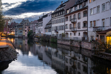 Obraz premium Evening Postcard View Petite France Canal Glowing Windows