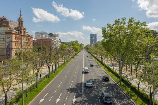  Paseo de la Castellana on a holiday or Sunday morning, with very little traffic, almost empty, and a few people walking or cycling