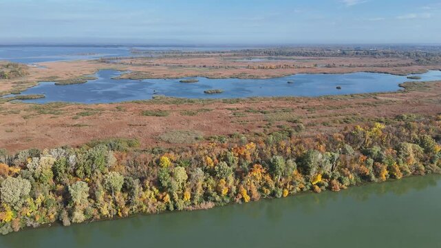 Aerial drone shot over blue water of Tisza Lake Hungary