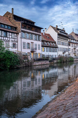 Naklejka premium Dusk Canal Reflections Timbered Houses Cobblestone Walk