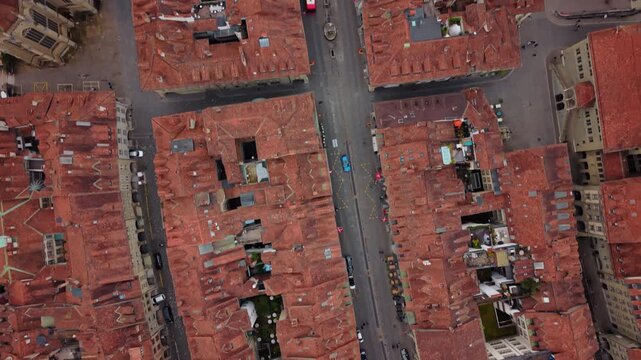 Aerial: Bern Old City with main street during the day in Canton of Bern, Switzerland, top down drone shot