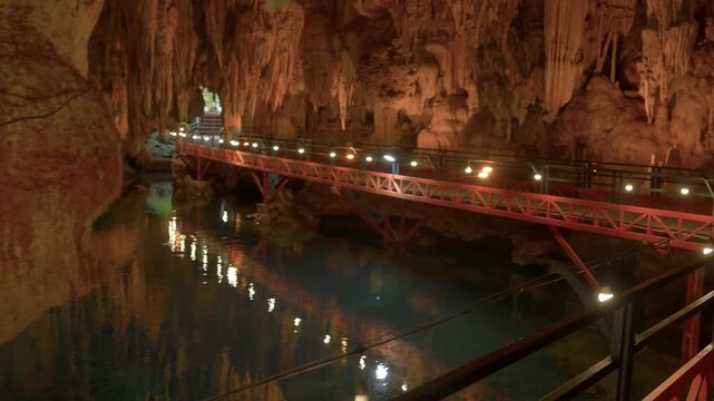 Tham Pa Sueam cave walkway near the entrance and exit point with still water jsut below the boardwalk.