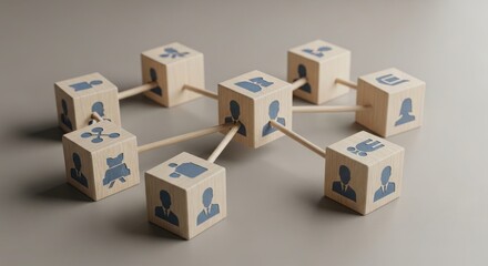 Fototapeta premium Interconnected wooden blocks with icons representing teamwork and collaboration